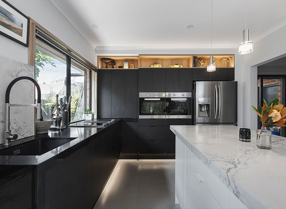 photo of a newly renovated dark colour scheme kitchen interior